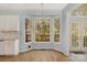 Charming breakfast nook with bay window and hardwood floors, perfect for casual dining at 3109 Savannah Hills Dr, Matthews, NC 28105
