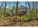 View of rear facade showing the deck, screened porch and bridge at 3109 Savannah Hills Dr, Matthews, NC 28105