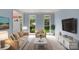 Comfortable living room featuring neutral furniture, light blue accent walls, and natural light at 3109 Savannah Hills Dr, Matthews, NC 28105