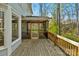 Close up of the rear porch with wooden decking and a screened exterior at 3109 Savannah Hills Dr, Matthews, NC 28105