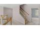 Hallway featuring a carpeted staircase with wooden banisters leading to the upper floor at 3109 Savannah Hills Dr, Matthews, NC 28105