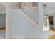 Traditional staircase with white railings and wooden banister, leading to the upper level at 3109 Savannah Hills Dr, Matthews, NC 28105