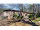 The home's back exterior has a patio, greenhouse, and brick paved walkway at 3407 14Th Sw Ave, Hickory, NC 28602
