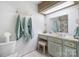 Bathroom features tile flooring, a vanity with a white countertop, and framed mirror with a shower at 3407 14Th Sw Ave, Hickory, NC 28602