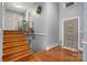 Hallway with hardwood floors leading to the staircase and rooms at 3407 14Th Sw Ave, Hickory, NC 28602