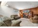 Cozy living room with comfortable seating, wood paneling, and built-in shelving at 3407 14Th Sw Ave, Hickory, NC 28602
