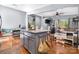 Open-concept living area with granite island, stainless steel appliances, hardwood floors, and a cozy seating area at 3407 14Th Sw Ave, Hickory, NC 28602
