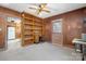 Office featuring wood paneling, built-in bookshelves, and an adjacent kitchen at 3407 14Th Sw Ave, Hickory, NC 28602
