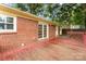 Brick home featuring a spacious deck and beautiful French doors at 4107 Windwood Dr, Gastonia, NC 28056
