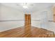 Bedroom featuring hardwood floors, neutral walls, ceiling fan, closet and ensuite access at 4107 Windwood Dr, Gastonia, NC 28056