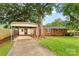 View of the house, carport, and a spacious driveway at 4107 Windwood Dr, Gastonia, NC 28056