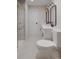 Modern bathroom featuring a double sink vanity, a glass-enclosed shower, and neutral color tones at 4969 Fitzgerald Ave, Charlotte, NC 28213