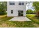 Private backyard featuring a concrete patio and well-maintained lawn at 506 Legrand St, Shelby, NC 28150