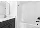 Bathroom featuring a black vanity and shower/tub combination at 506 Legrand St, Shelby, NC 28150