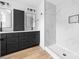 Modern bathroom with marble shower and black cabinets at 506 Legrand St, Shelby, NC 28150