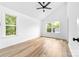 Bright bedroom with natural light from two windows and vaulted ceilings with a modern fan at 506 Legrand St, Shelby, NC 28150