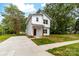 Charming two-story home with modern design, white siding, and a concrete driveway at 506 Legrand St, Shelby, NC 28150
