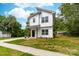 Charming two-story home with modern design, white siding, and a grassy yard at 506 Legrand St, Shelby, NC 28150