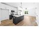 Bright kitchen featuring stainless steel appliances, an island with a sink, and modern cabinetry at 506 Legrand St, Shelby, NC 28150