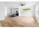 Bright, open-concept living space with modern kitchen and wood flooring at 506 Legrand St, Shelby, NC 28150