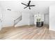 Spacious living room with modern kitchen, staircase, and wood flooring at 506 Legrand St, Shelby, NC 28150