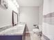 Bathroom with granite vanity top, modern mirror, and toilet at 605 Allen Way, Indian Trail, NC 28079