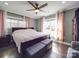 Inviting bedroom offering a king-sized bed, bench seating, and large windows with an abundance of natural light at 605 Allen Way, Indian Trail, NC 28079