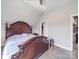 Charming bedroom with a large decorative bed, ample closet space, and private access to a tiled bathroom at 605 Allen Way, Indian Trail, NC 28079