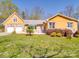 Front exterior and yard of home featuring an attached two-car garage at 605 Allen Way, Indian Trail, NC 28079
