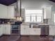Updated kitchen featuring stainless steel appliances, including double oven and stainless steel sink at 605 Allen Way, Indian Trail, NC 28079