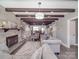 Open-concept living room with exposed beams, a fireplace, and comfortable seating at 605 Allen Way, Indian Trail, NC 28079