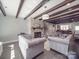 Cozy living room with exposed beams, a fireplace, and comfortable seating at 605 Allen Way, Indian Trail, NC 28079