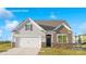 Charming single-Gathering home featuring a two-car garage, a covered front porch, and craftsman-style details at 808 Candy Dr, Statesville, NC 28677