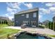 Spacious backyard features a koi pond, paver patio, and a built in grill for outdoor enjoyment at 16718 Keene Ct, Charlotte, NC 28278