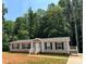 Charming single-story home features a well-maintained yard and inviting front entrance at 185 Crystal Bay Dr, Mooresville, NC 28115