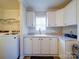 Laundry room with cabinets, sink and countertop space and front load washer and dryer at 185 Crystal Bay Dr, Mooresville, NC 28115