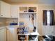 Mud room featuring a bench with storage, coat hooks, and storage cabinets at 185 Crystal Bay Dr, Mooresville, NC 28115