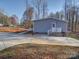 Rear exterior view showing the back of the house with a patio at 185 Crystal Bay Dr, Mooresville, NC 28115