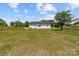 Spacious backyard featuring a privacy fence, lush green lawn, perfect for outdoor activities and entertaining at 2363 Reepsville Rd, Lincolnton, NC 28092