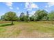 Large backyard featuring a new wooden privacy fence, lush green lawn, offering plenty of space for outdoor activities at 2363 Reepsville Rd, Lincolnton, NC 28092