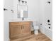 A well-lit bathroom with wood-tone cabinets complemented by a clean, white countertop and modern fixtures at 2363 Reepsville Rd, Lincolnton, NC 28092