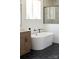 Modern bathroom featuring soaking tub, black accents, and large window at 2363 Reepsville Rd, Lincolnton, NC 28092