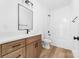 This bathroom is equipped with wood-tone cabinets and features a tub and shower combination at 2363 Reepsville Rd, Lincolnton, NC 28092
