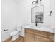 Bathroom features wood-look vanity, quartz countertop, framed mirror and modern fixtures at 2363 Reepsville Rd, Lincolnton, NC 28092