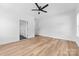 This light-filled bedroom boasts wood floors, ceiling fan, and convenient closet and door access at 2363 Reepsville Rd, Lincolnton, NC 28092