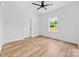 A bedroom that includes a ceiling fan, wood floors, and a window offering a bright outdoor view at 2363 Reepsville Rd, Lincolnton, NC 28092