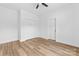 A bedroom featuring wood floors, a ceiling fan, and a double-door closet for ample storage space at 2363 Reepsville Rd, Lincolnton, NC 28092