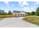 Charming home featuring wood accents, a dark roof, complemented by a lush green landscaped front yard at 2363 Reepsville Rd, Lincolnton, NC 28092