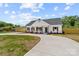 Charming two-story home featuring wood accents, a dark roof, complemented by a landscaped front yard at 2363 Reepsville Rd, Lincolnton, NC 28092