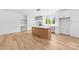 Bright open kitchen with island, stainless appliances and views to adjacent spaces at 2363 Reepsville Rd, Lincolnton, NC 28092